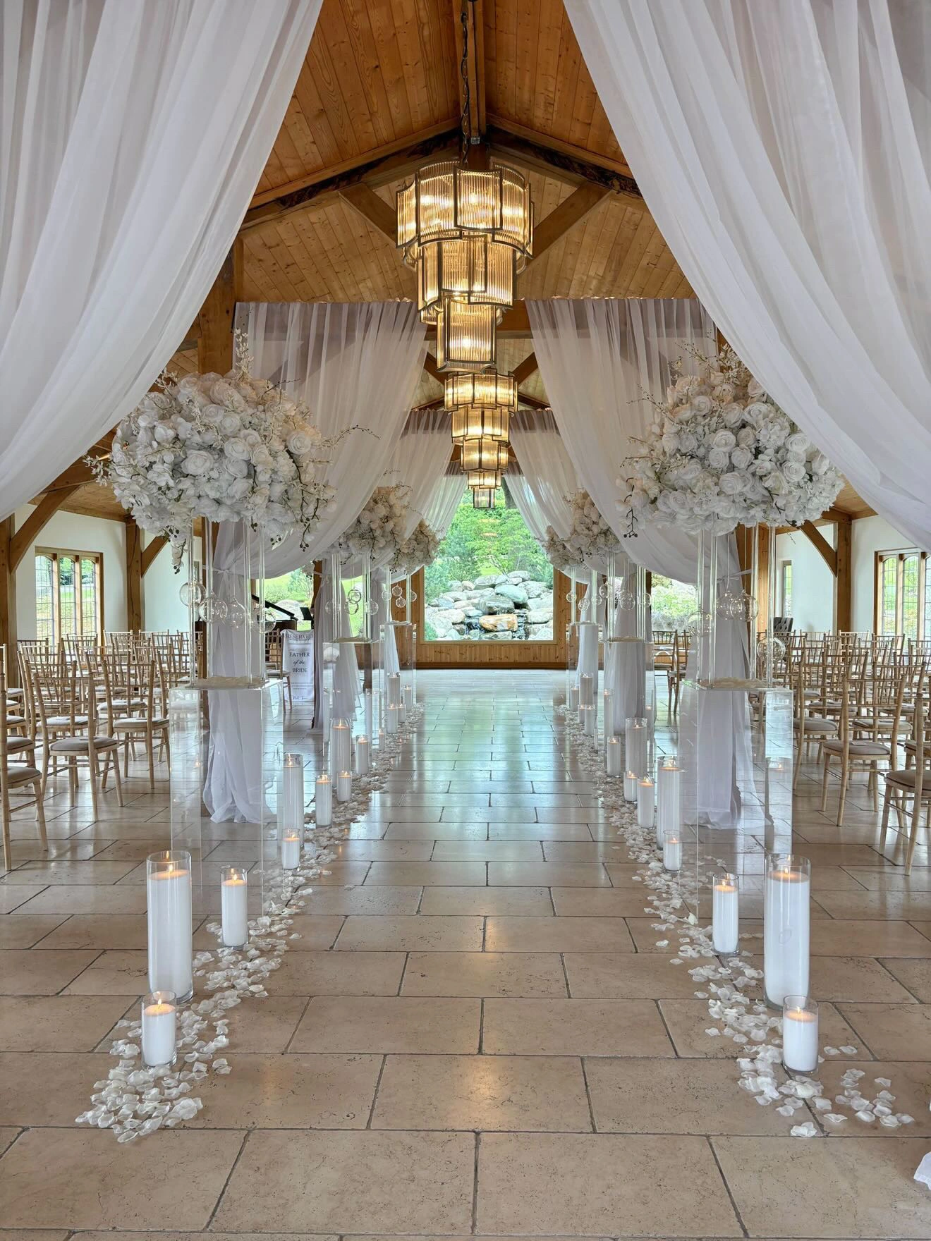 White draping and floral arrangements in the Colshaw Hall ceremony room